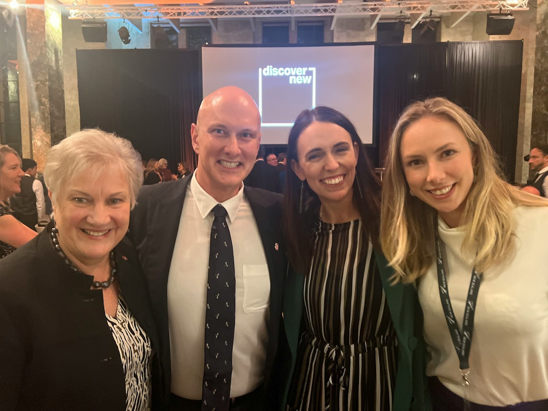 A photo of four people all smiling into the camera. From left it's Annette King (High Commissioner of New Zealand to Australia), Brendan Doggett (Country Manager of Sharesies Australia), Jacinda Ardern (Prime Minister of New Zealand), and Brooke Roberts (co-founder and co-CEO of Sharesies). 