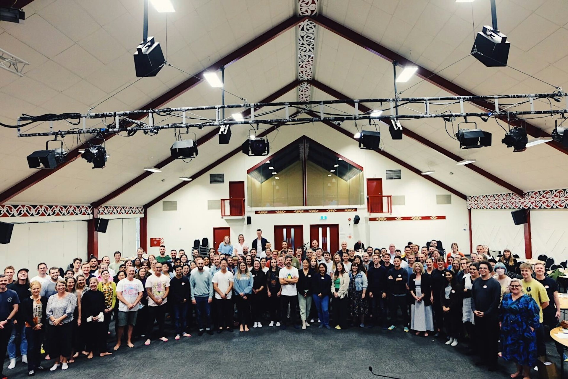 A picture of the full Sharesies team at Pipitea Marae in Wellington New Zealand. 