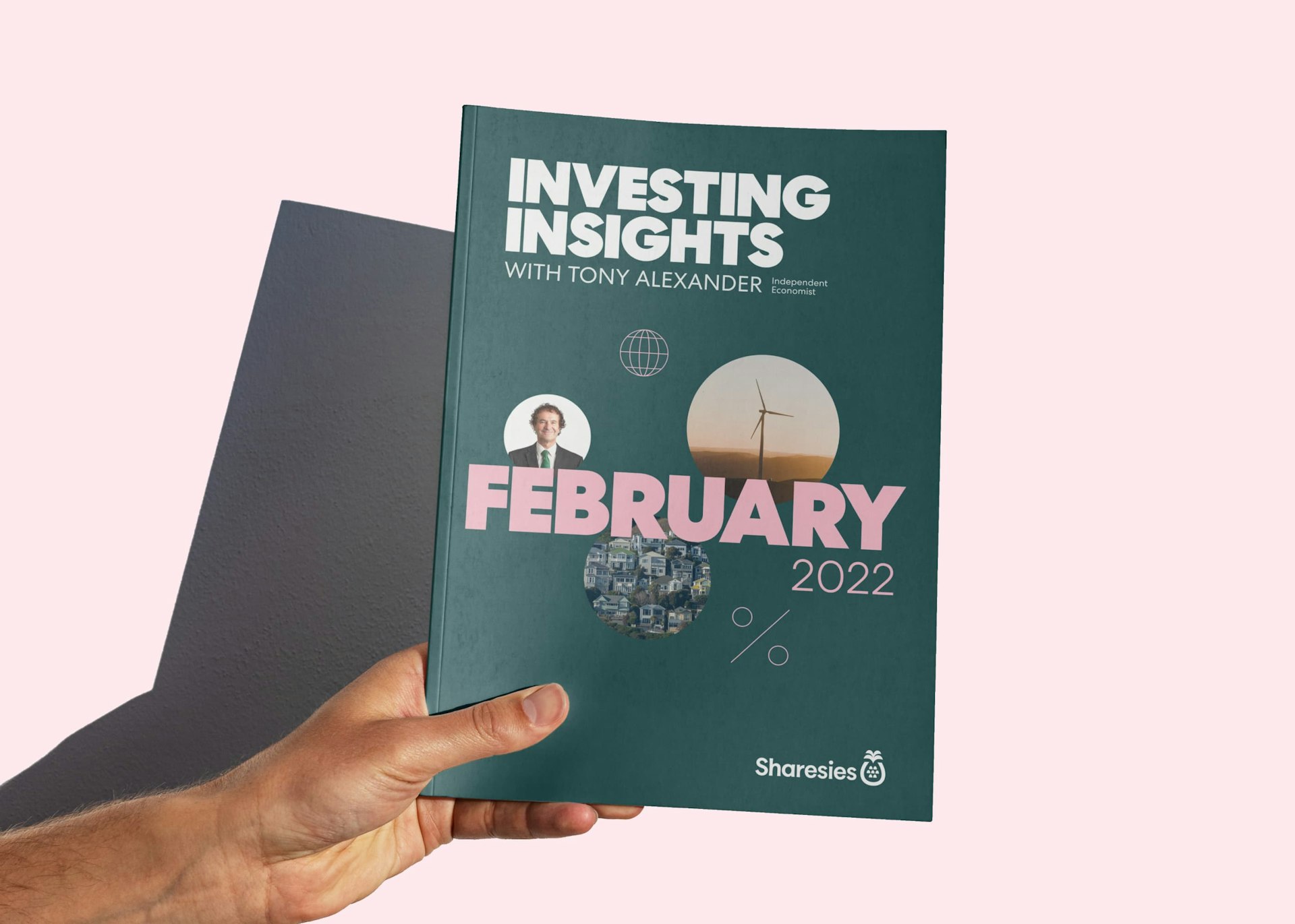 The Investing Insights report is held in a hand.
